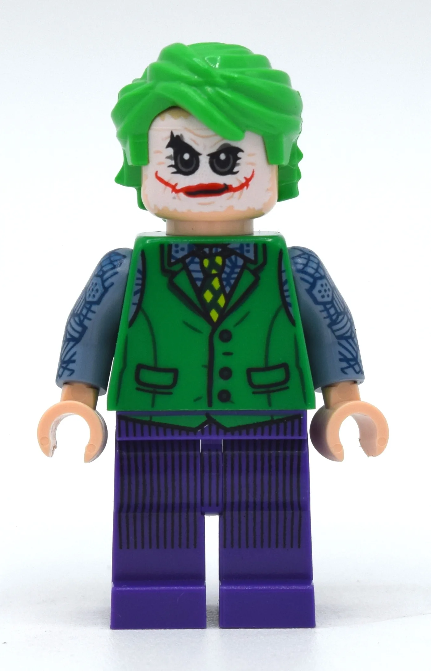 The Joker with Green Vest and White Face Make… — minifigurine LEGO | Brick Broker