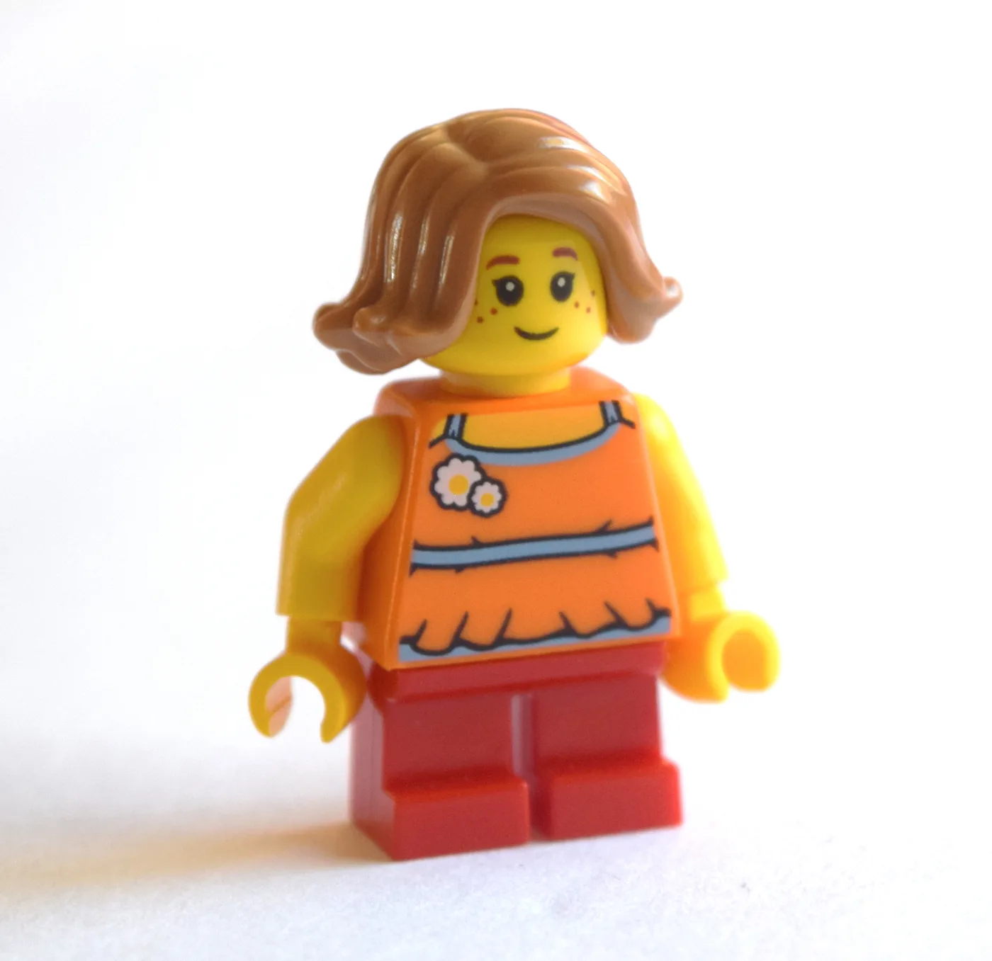 Girl, Orange Top, Short Red Legs, Medium Noug… — minifigurine LEGO | Brick Broker